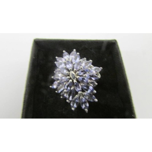 119 - A tanzanite ornate cluster gold ring, size M half.