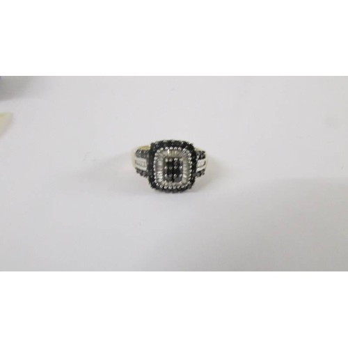 120 - A square shaped yellow gold diamond and sapphire ring, size M.