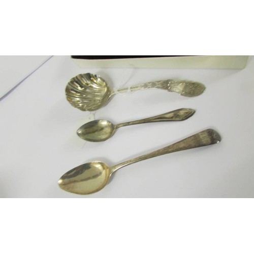 231 - A silver handled knife, silver sifter spoons and two silver teaspoons.