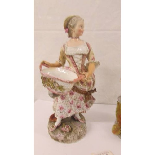 271 - A pair of 19th century porcelain figurines, 11