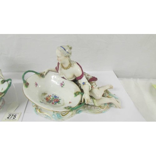 275 - A pair of fine porcelain male and female figure/sweet meat dishes with crossed swords mark.