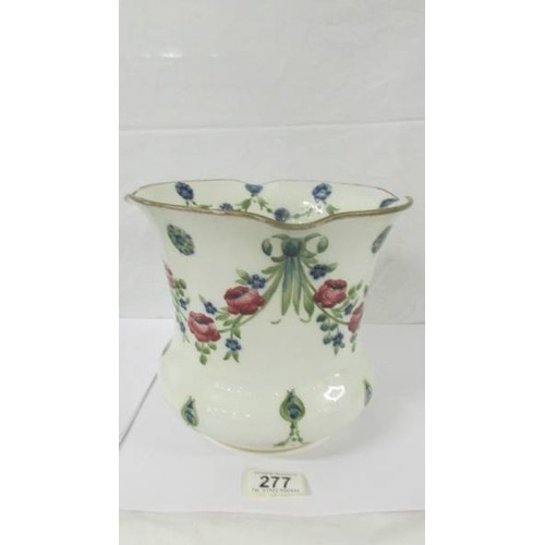 277 - An early William Moorcroft swags and roses jardiniere green script, (hairline crack to rim).