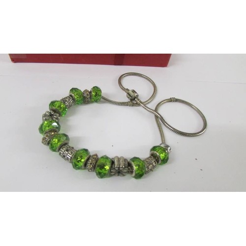 133 - A Pandora necklace and bracelet with nine silver charms on each (925).