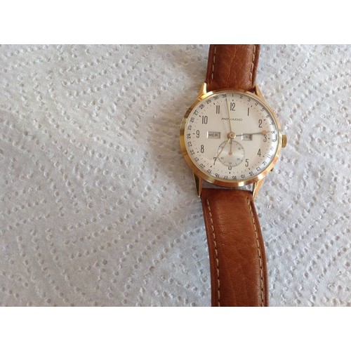 131 - A Movado 18ct gold 1950's gent's wrist watch, fully serviced.