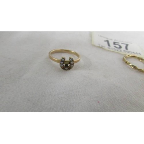 157 - A ring set seed pearls (two missing) an another ring, both size F. (both test as gold).