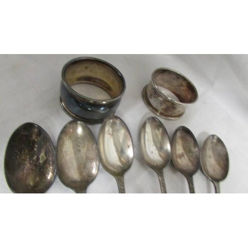 158 - Six silver teaspoons and two silver napkin rings, approximately 100 grams.