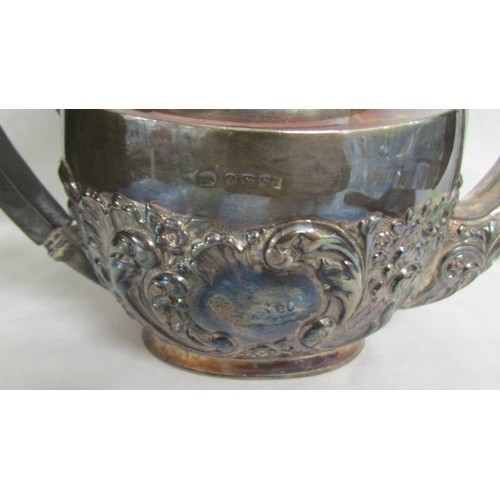 160 - A decorative silver teapot. Approximately 330 grams.