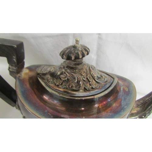 160 - A decorative silver teapot. Approximately 330 grams.