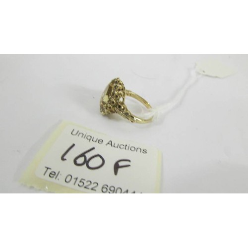 160F - A 9ct gold ring set large citrine, size N.