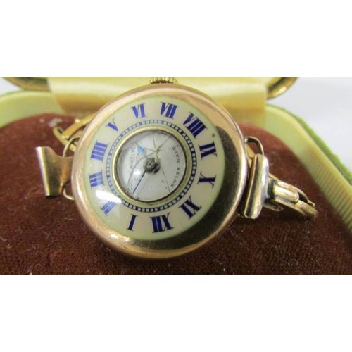 160N - A gold watch made by Cooke and Kelvey of Calcutta witha CYMA Swiss movement. Inscribed 