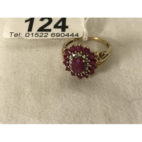 124 - A yellow gold ruby and diamond ring, size P.