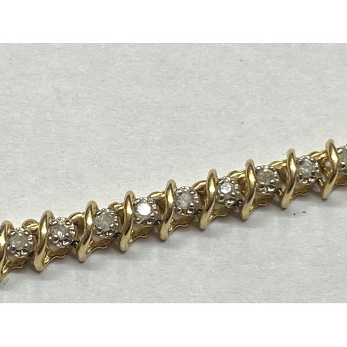 116 - A yellow gold and diamond tennis bracelet.