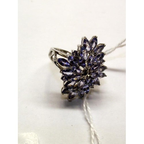 119 - A tanzanite ornate cluster gold ring, size M half.