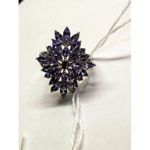 119 - A tanzanite ornate cluster gold ring, size M half.