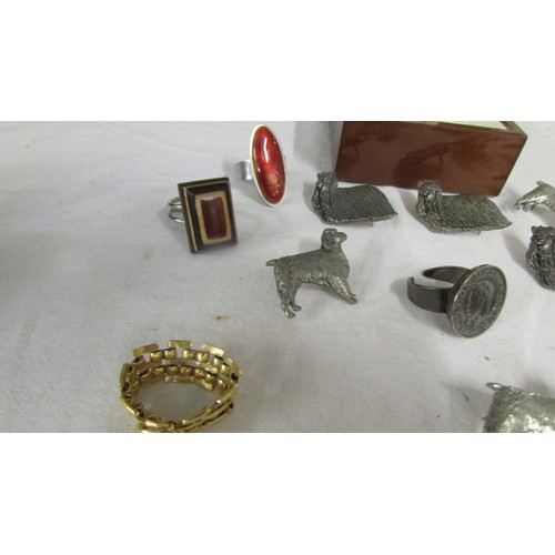 1002 - A mixed lot of rings, dog badges etc.,