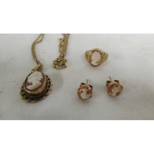 1021 - A 9ct gold cameo necklace, ring and earrings.