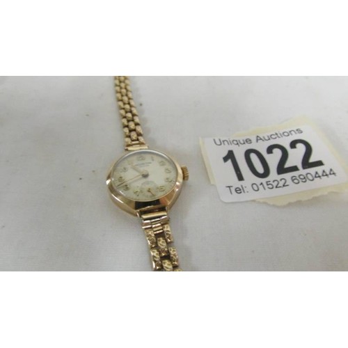 1022 - A Winegartens of London ladies gold wrist watch.