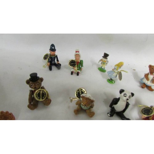 1024 - A collection of pewter and lead miniatures figures including Punch, Judy, bears etc.,