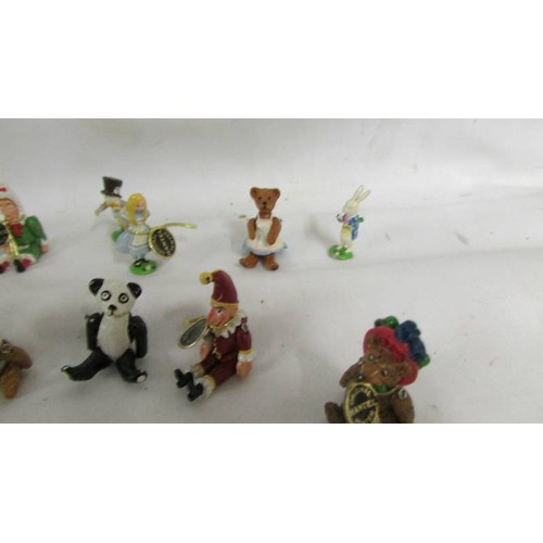 1024 - A collection of pewter and lead miniatures figures including Punch, Judy, bears etc.,