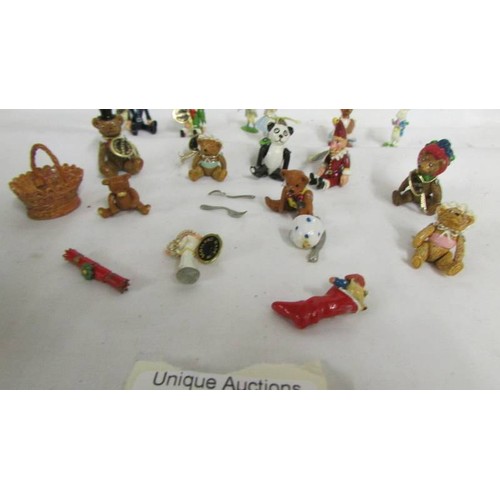 1024 - A collection of pewter and lead miniatures figures including Punch, Judy, bears etc.,