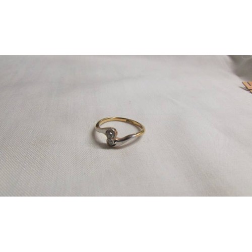 1035 - An 18ct gold and diamond ring, size M, 2.3 grams.