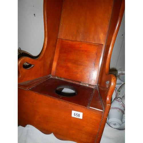 658 - A Victorian rocking child's commode chair.  (Collect only)