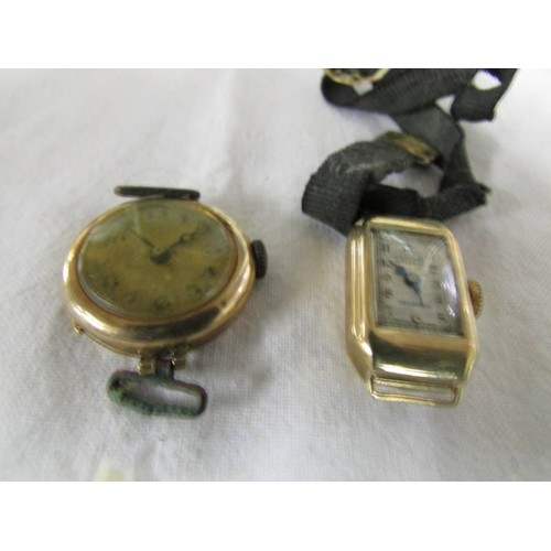 1095 - Two old gold watch heads.