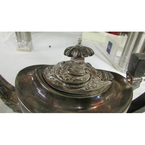 1128 - A decorative silver teapot, approximately 330 grams.