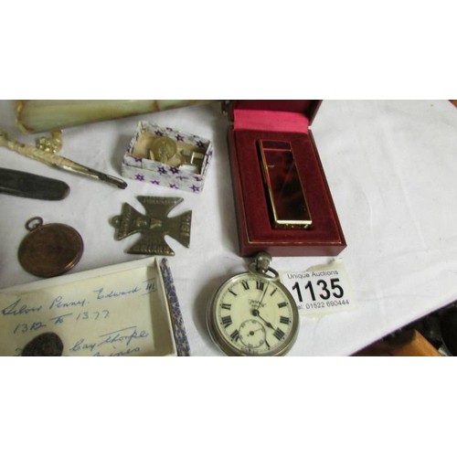 1135 - An Onyx jewellery box with cuff links, badges, medallions etc.,