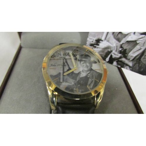 1141 - A boxed John Wayne wrist watch.