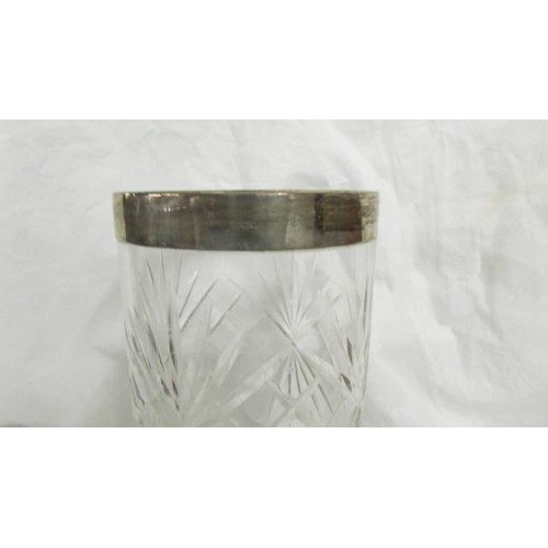 1181 - A cut glass vase with silver collar.