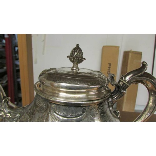 1198 - A good quality silver plate teapot (hinge needs repair).