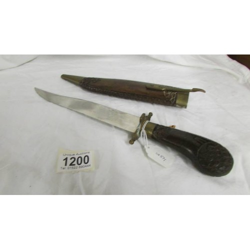 1200 - A dagger in a wooden sheath.