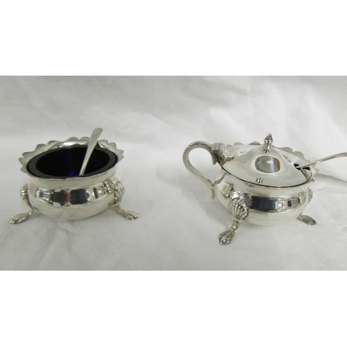 1213 - A three piece hall marked condiment set with blue plastic liners, silver weight 130 grams.