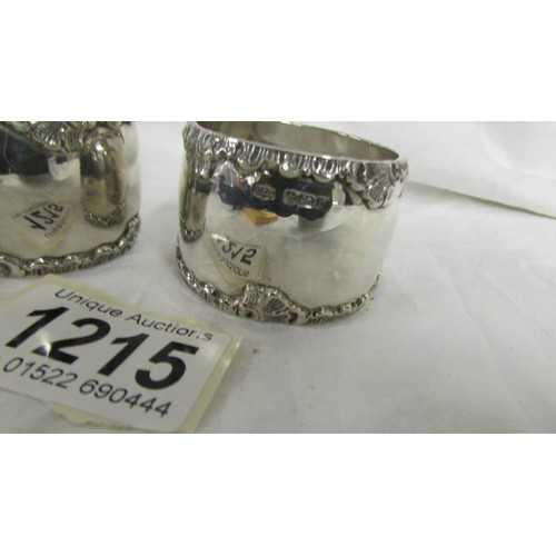 1215 - A pair of hall marked silver napkin rings, 85 grams.