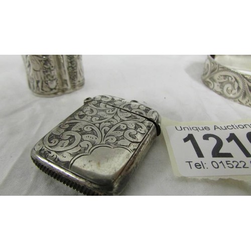 1216 - A silver vesta case, a silver snuff box and a silver bangle, 65 grams.