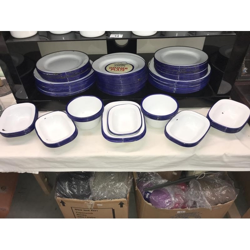 14 - A large quantity of blue and white Falcon enamel dinner ware including mugs, plates etc.