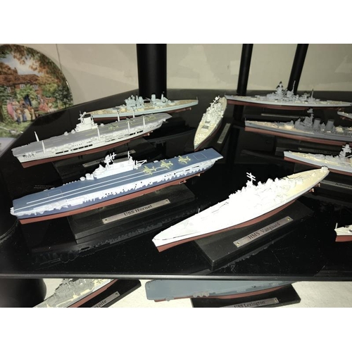 24 - A good selection of plastic/resin model battleships