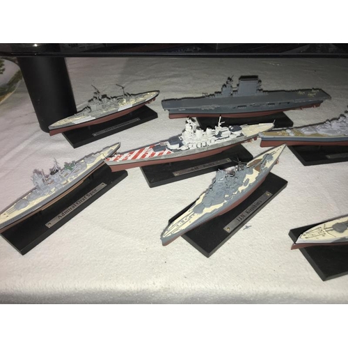 24 - A good selection of plastic/resin model battleships