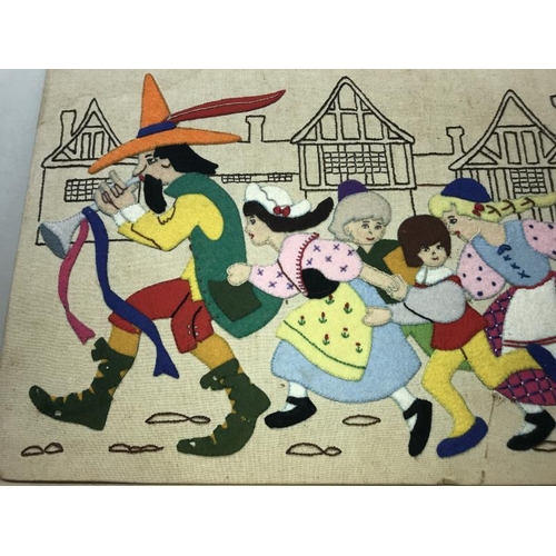 34 - A large felt patchwork of the Pied Piper of Hamelin 74cm x 36cm  COLLECT ONLY