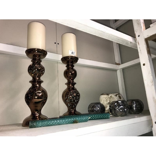 42 - A pair of lustreware candlesticks with pillar candles, 3 chrome tea light holders and pottery elepha... 