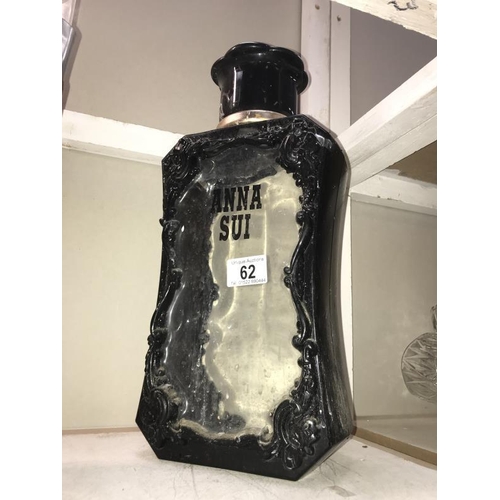 62 - A large Anna Sui perfumery/chemist shop display bottle, (no inner stopper so black loss from side of... 