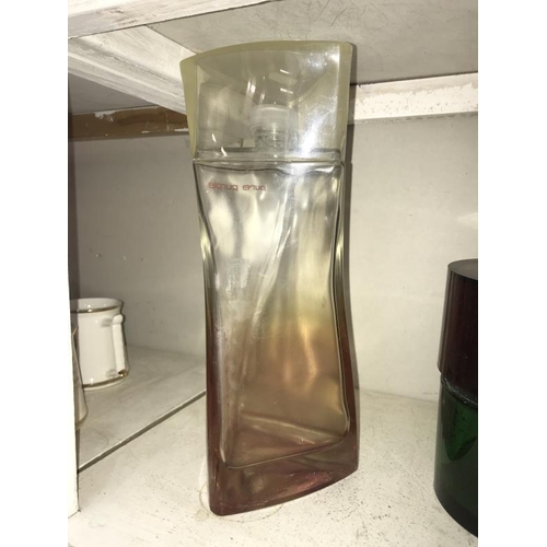 63 - A large Hugo Boss Pure Purple perfumery/chemist shop display bottle, height 34cm, (the contents are ... 