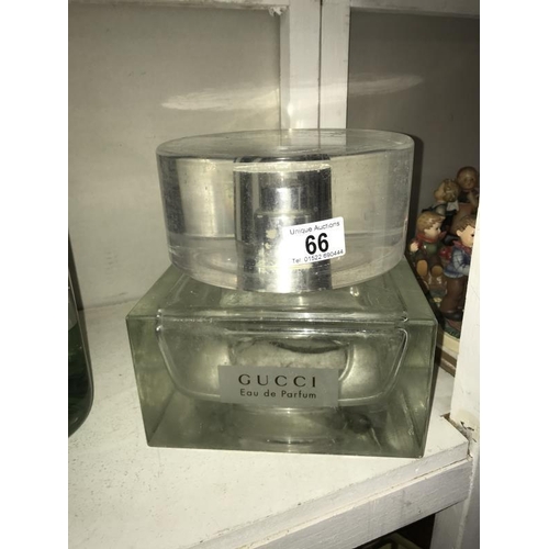 66 - A large Gucci Eau De Parfum perfumery/chemist shop display bottle, resin top,  size 20cm x 20cm x he... 