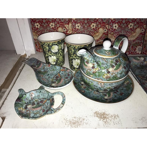 78 - A William Morris Strawberry Thief one person tea-set and place mats, plus 2 William Morris designed ... 