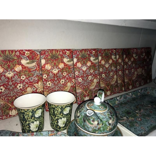 78 - A William Morris Strawberry Thief one person tea-set and place mats, plus 2 William Morris designed ... 