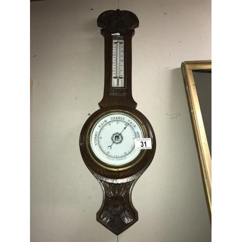 31 - An Edwardian oak aneroid barometer  COLLECT ONLY