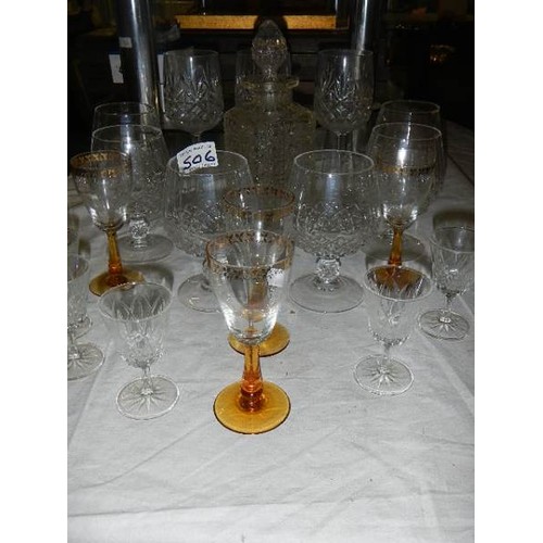 506 - A glass decanter, 6 cut glass drinking glasses and other glasses.