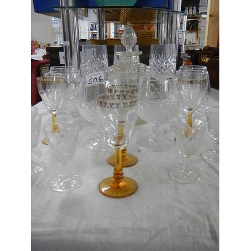 506 - A glass decanter, 6 cut glass drinking glasses and other glasses.