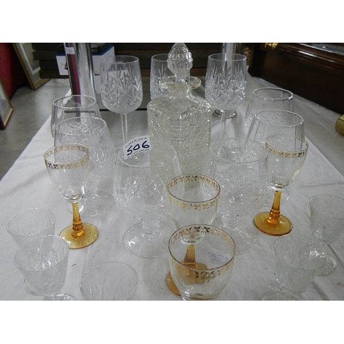 506 - A glass decanter, 6 cut glass drinking glasses and other glasses.